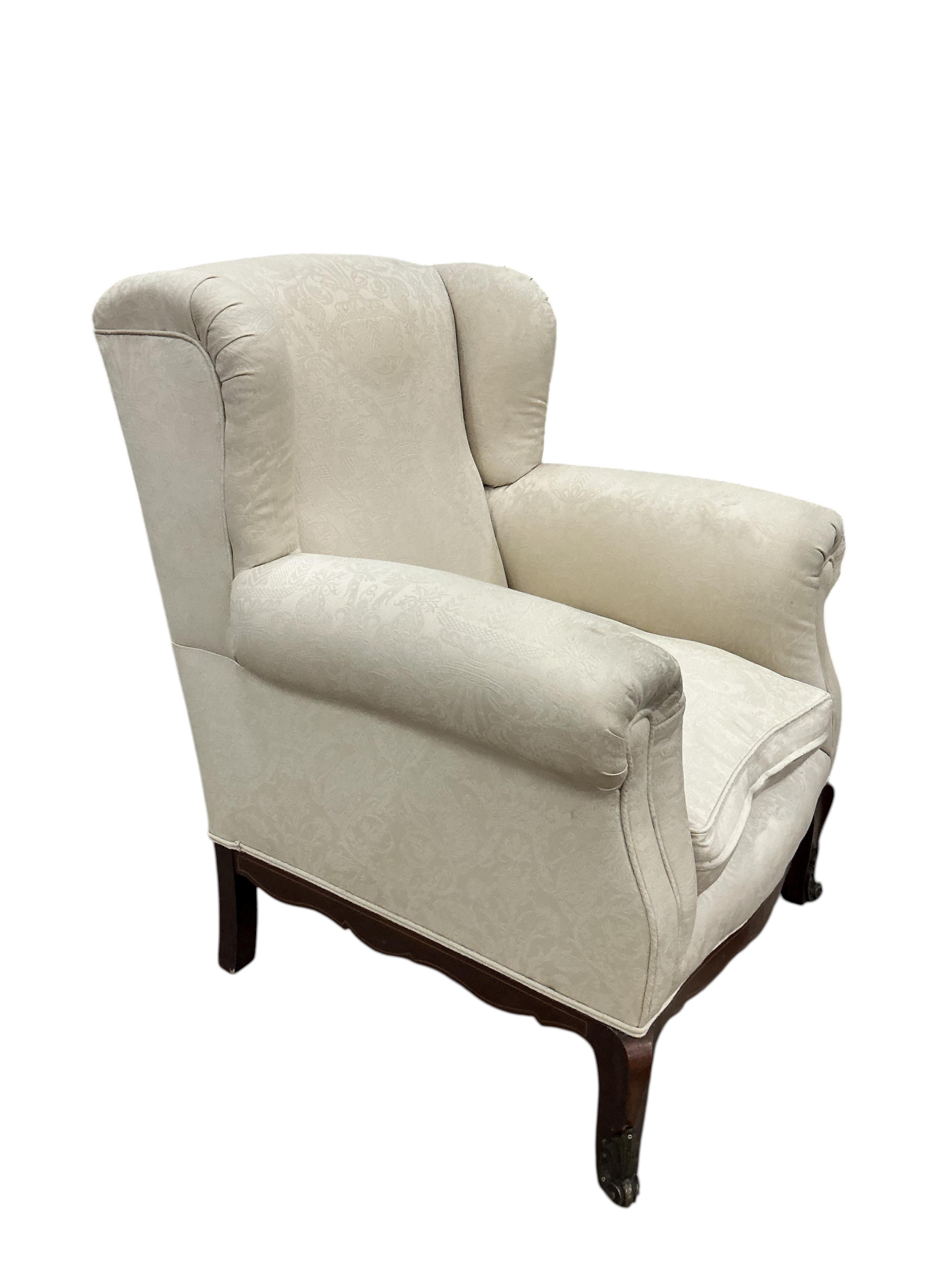 A late 19th century gilt metal mounted upholstered armchair, width 84cm, depth 76cm, height 100cm